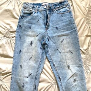 Blue jeans with snakes